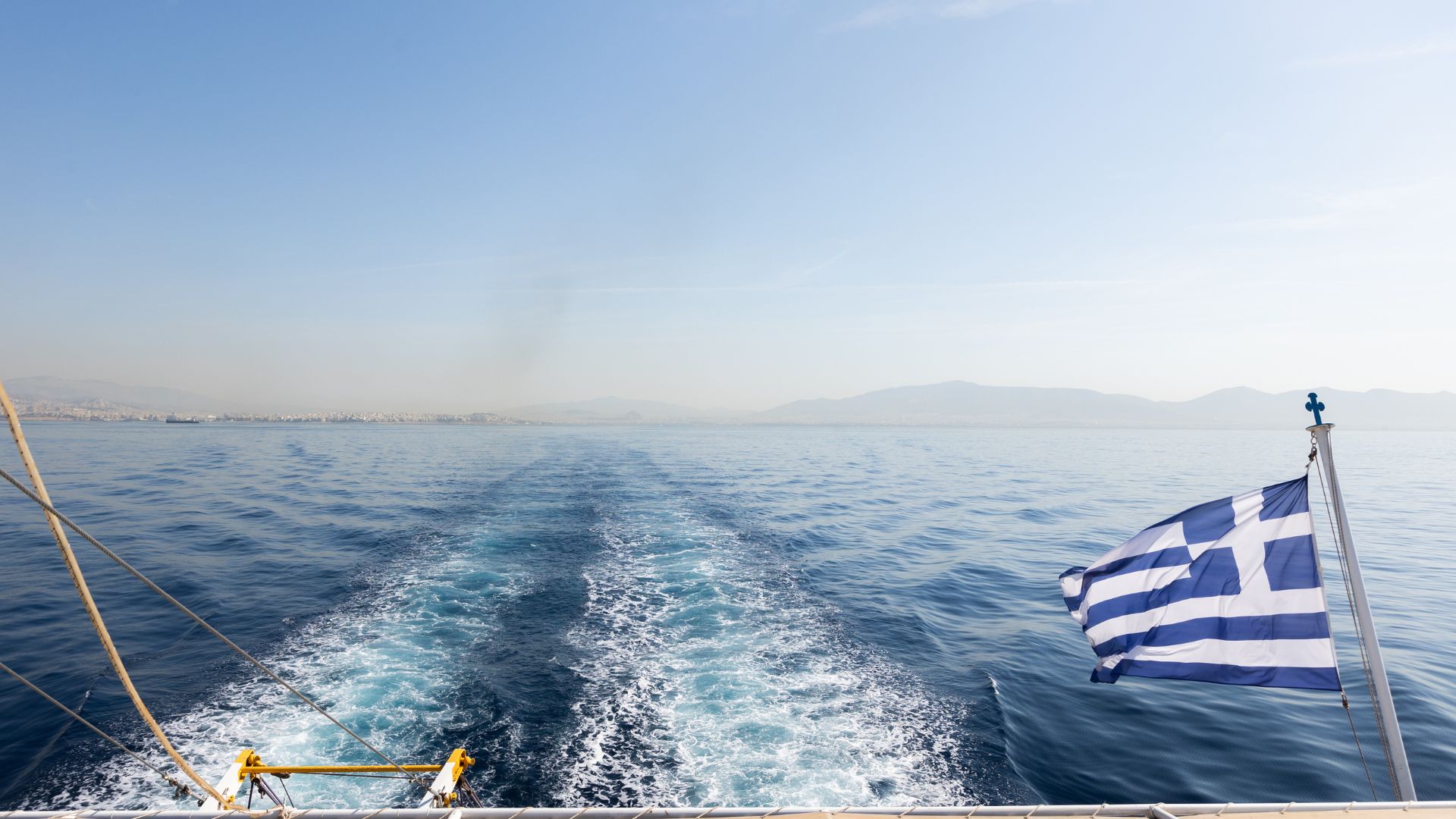 The view of the cruiseship from the back showing the picturesque Aegean deep blue waters