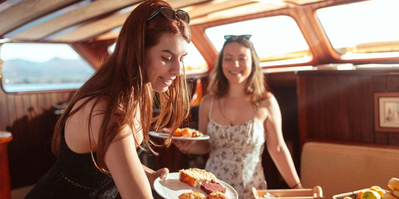Girs enjoying food out of the bouffe that the cruise provides