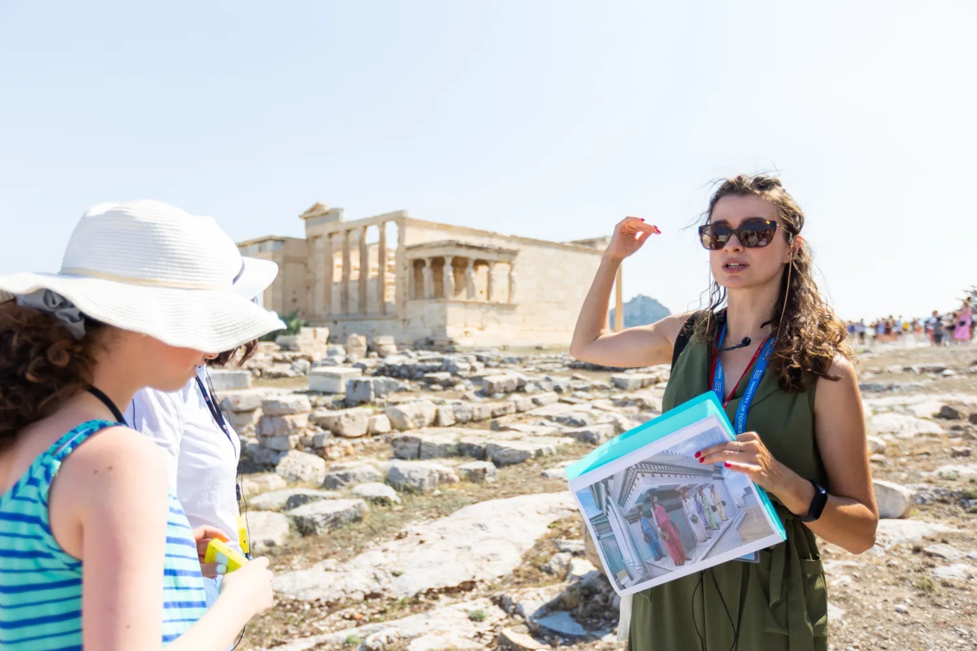 The expert guide explaining how the Erechtheion used to look like in ancient times, during one of the Athens Walking Tours by KeyTours.  