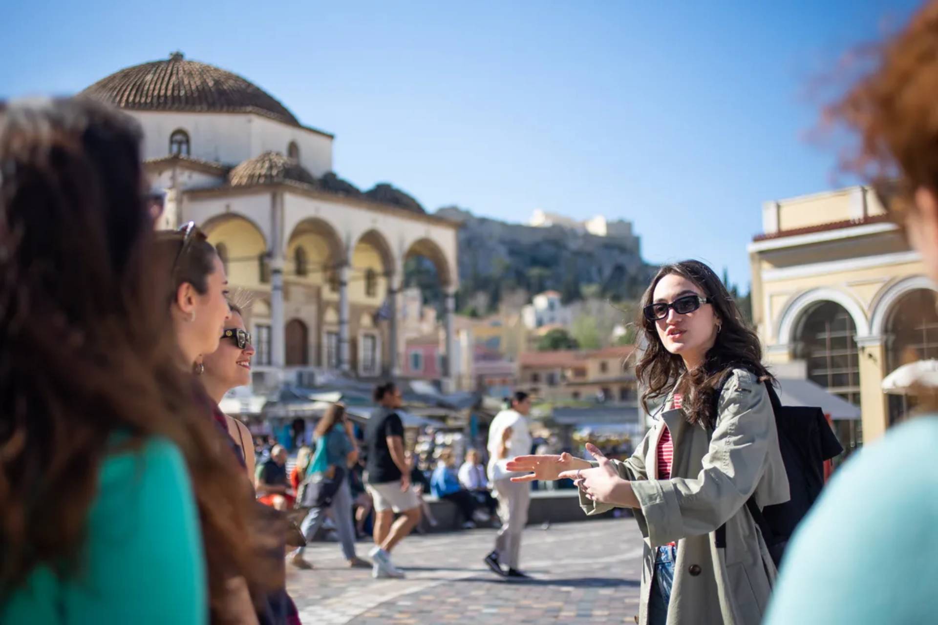 Group of individuals in Monastiraki Square, on the best food tour in Athens, by Keytours. 
