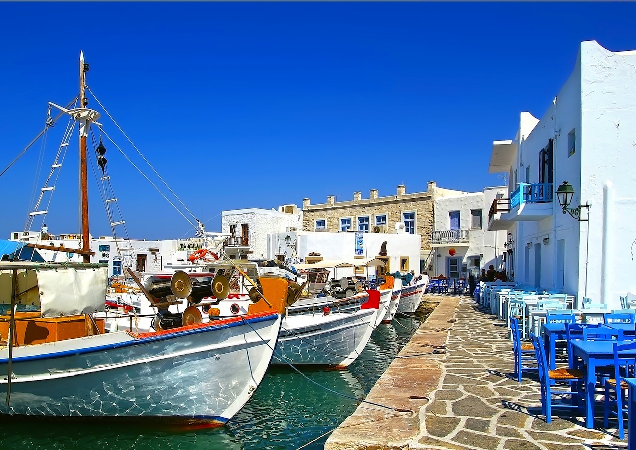 Cobblestone pavement near the sea with greek sefood tavernas in Paros