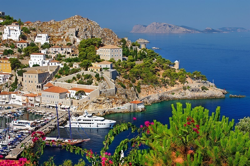 Snapshot of Hydra island harbour from above, waiting to be discovered on your next Greek island tours to the Saronic Gulf with Keytours.